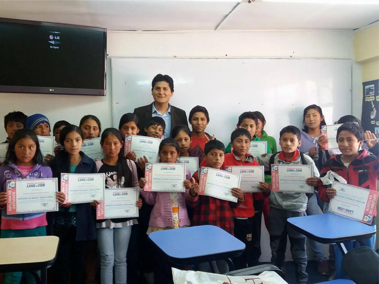 Group of low-income rural students in Huaraz celebrating their free Cambridge English certifications.